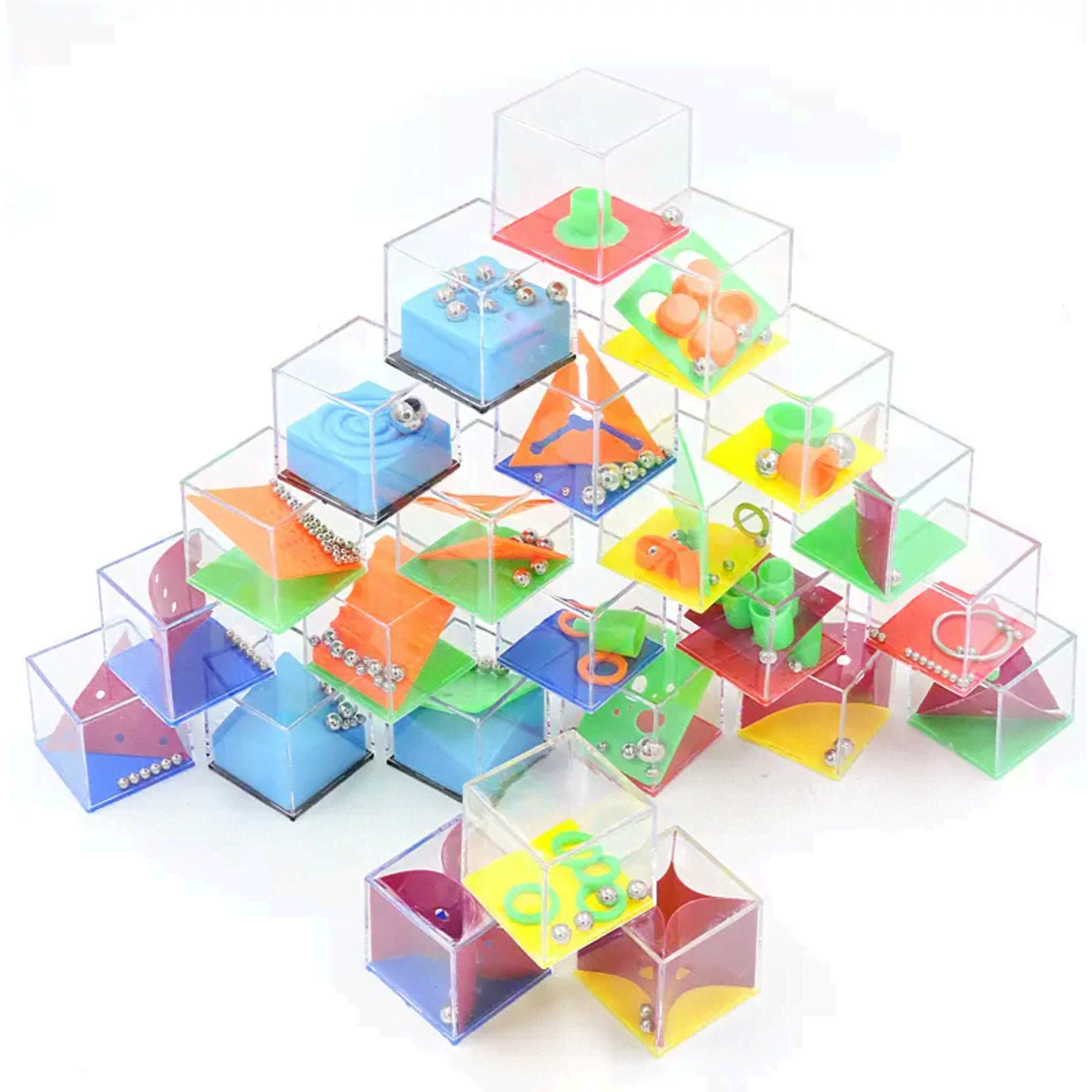A colourful arrangement of transparent mini cube puzzle boxes filled with various small items.