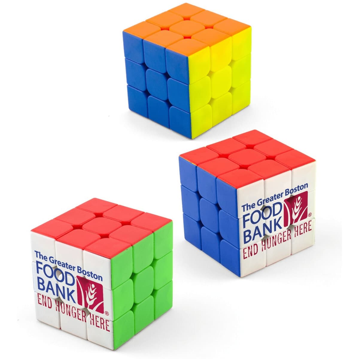 Three Puzzle Cubes in vibrant colours: orange, blue, green, and red, featuring a logo on one side.