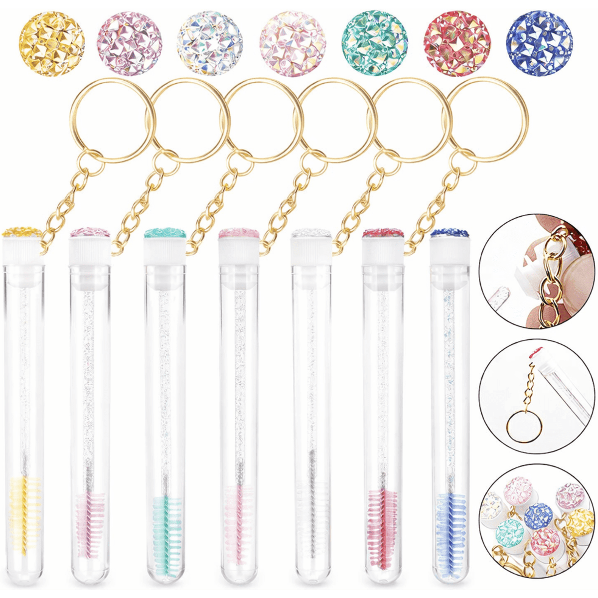 A set of mascara wand keychains in various colours, with glittery caps and gold keyring attachments.