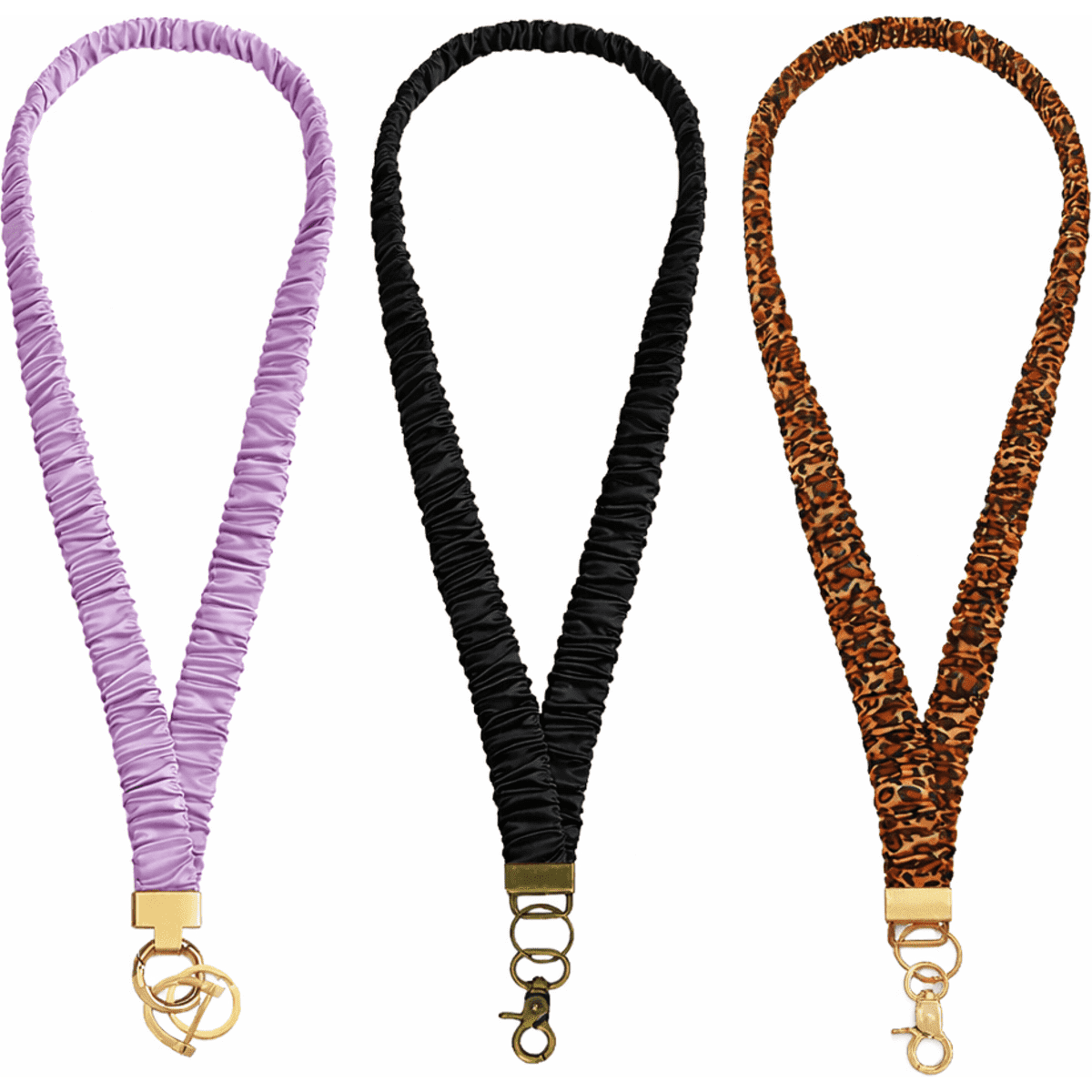 A collection of three lanyards in lavender, black, and leopard print, each with a gold clasp and gathered design.
