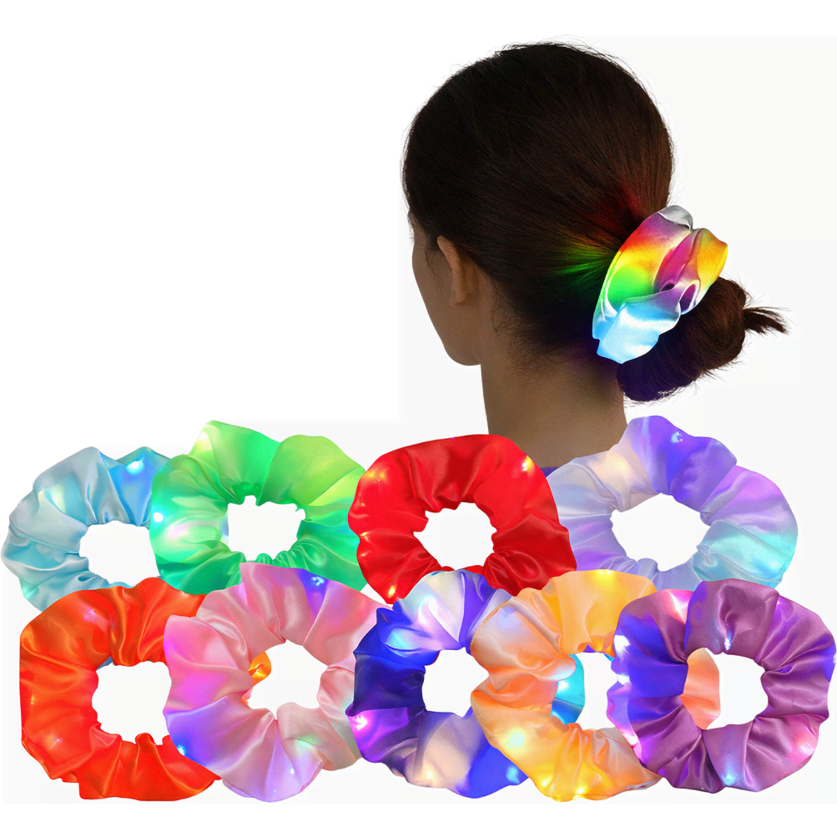 A collection of colourful light-up scrunchies displayed on a person's hair, featuring various shades like red, green, and purple.