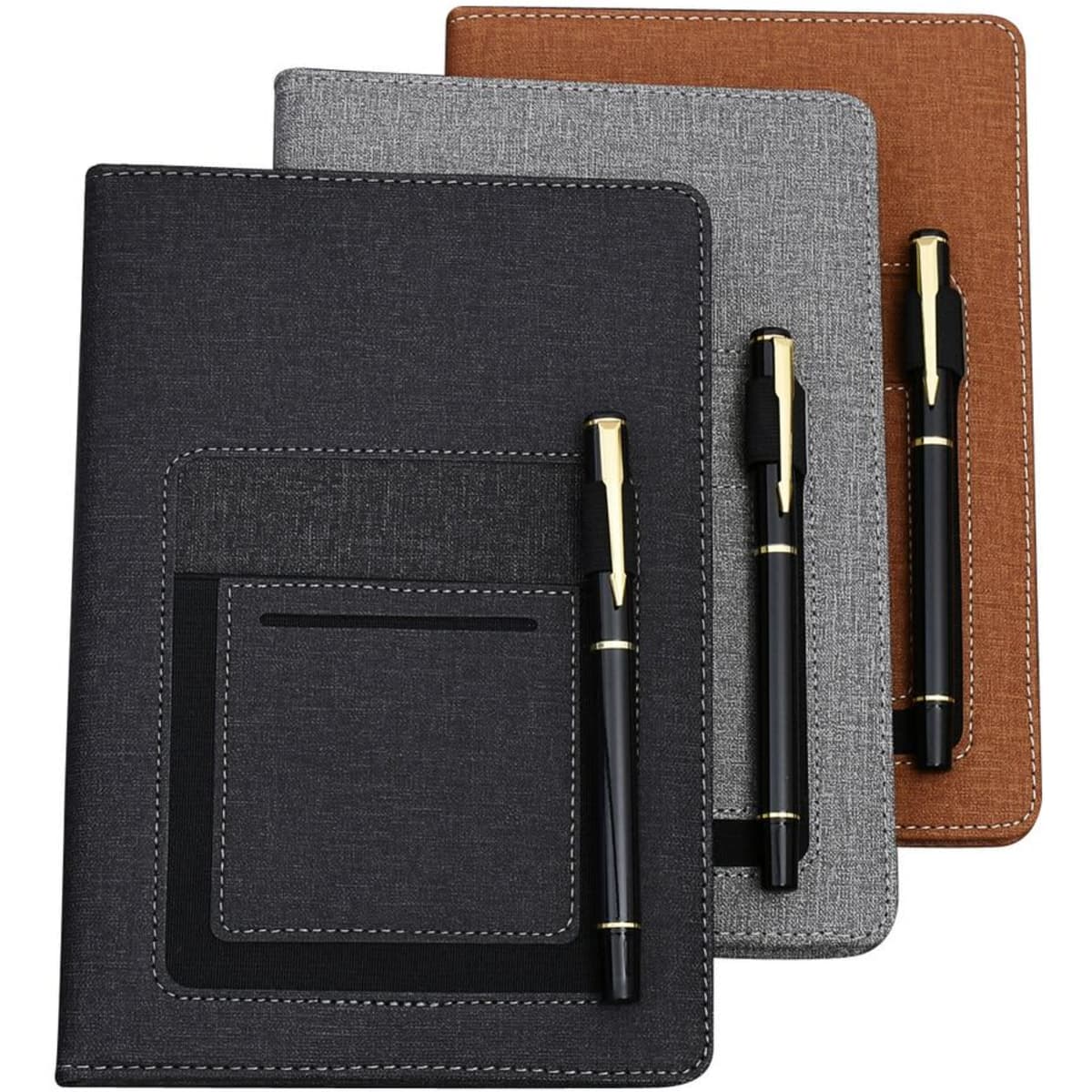 A set of three notebooks in black, grey, and brown, each paired with a pen. All feature a pocket on the front.