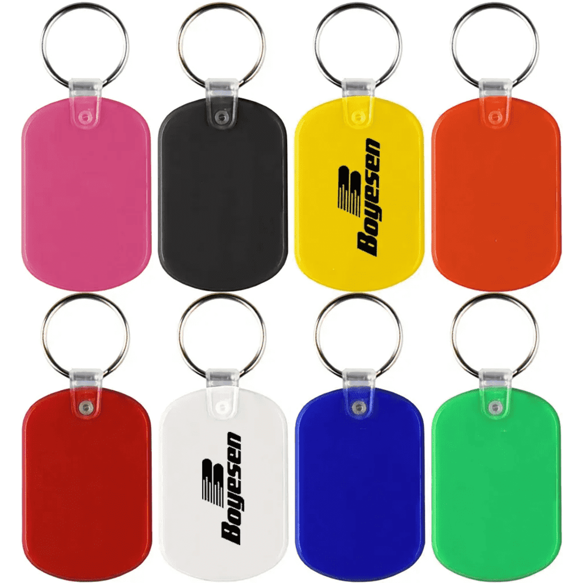A collection of PVC key tags in pink, black, yellow, orange, white, blue, and green, featuring a logo on some.