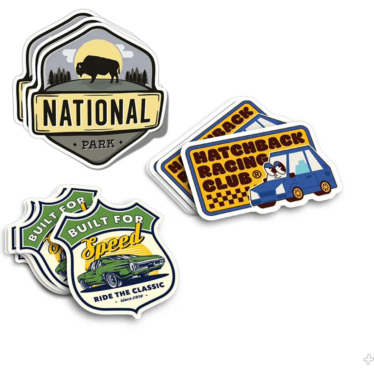 A collection of die cut stickers in various designs and colours, featuring themes like parks, cars, and racing.