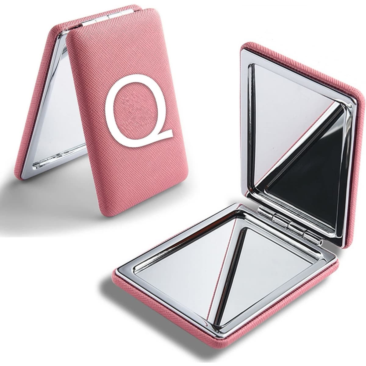 A pink portable mirror with a textured exterior and a logo, featuring two reflective surfaces inside.