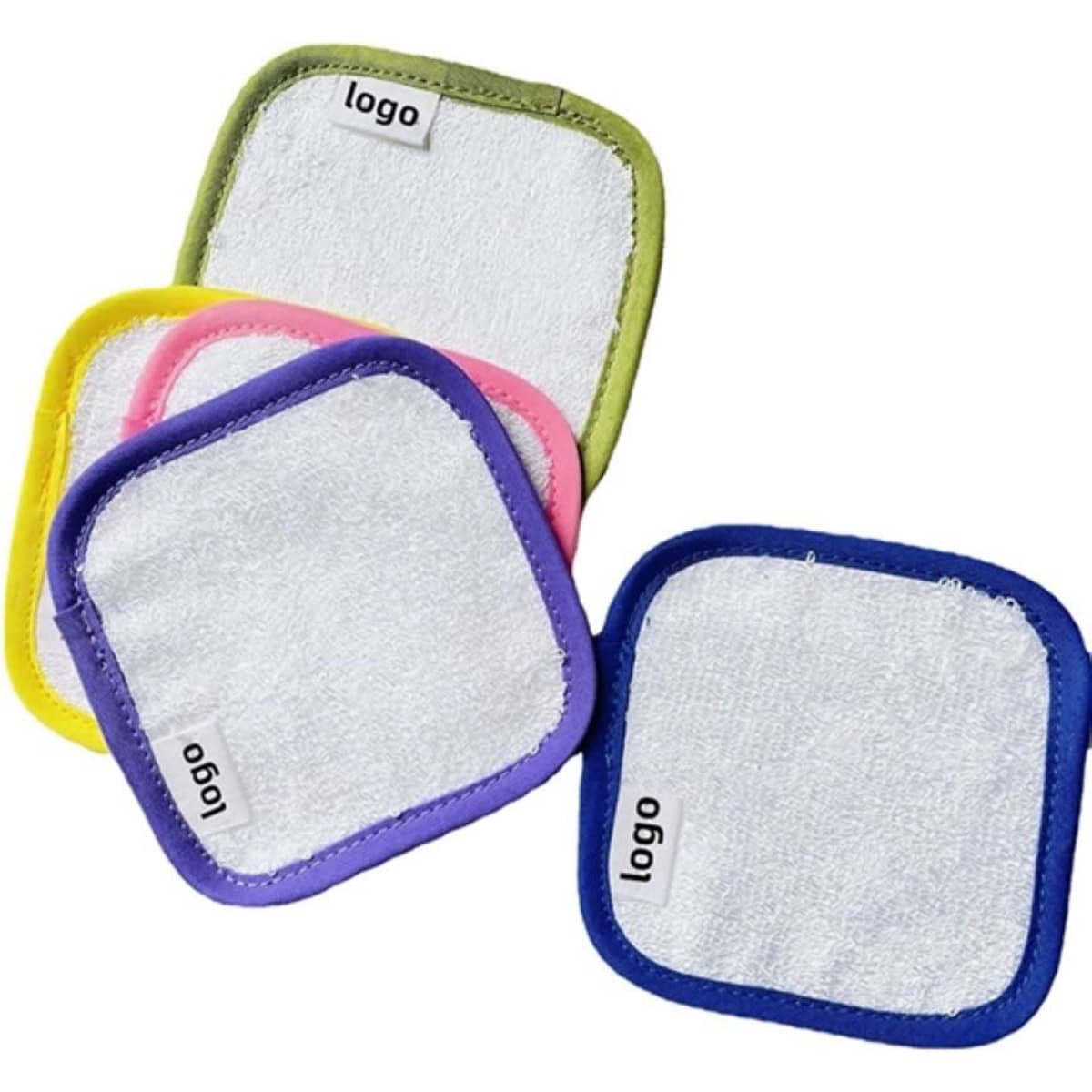A set of square makeup remover pads in white with colourful borders: yellow, pink, green, and purple. Each pad has a logo.