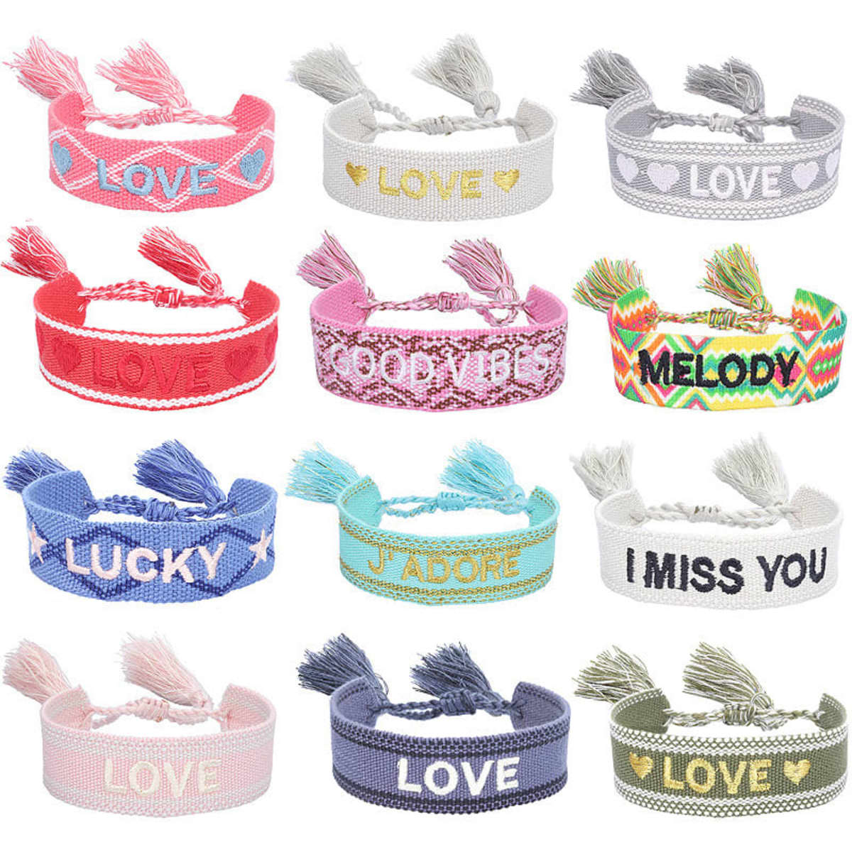 A collection of embroidered bracelets with tassels featuring various colours and messages, including pink, white, and blue.