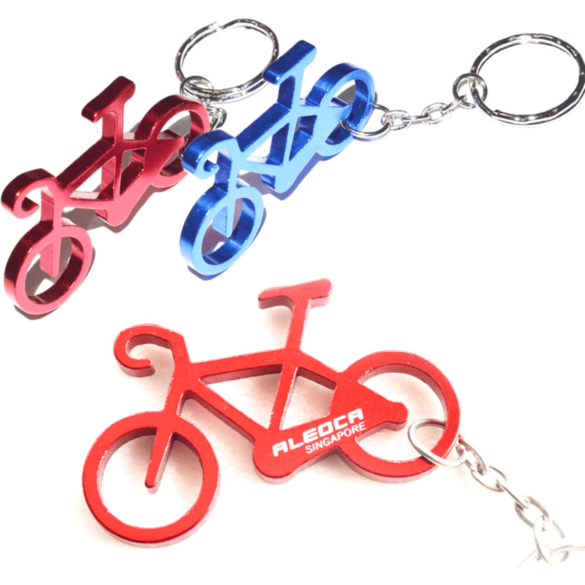 A drink bottle opener keychain featuring bicycle shapes in red and blue, with a metal keyring attachment.