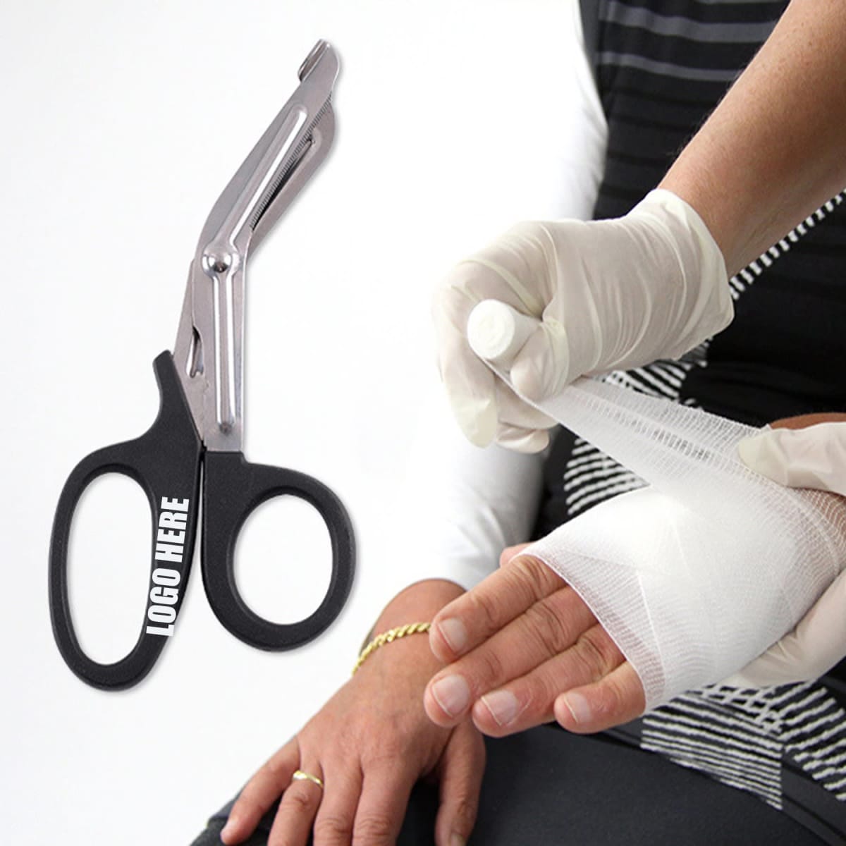 A pair of black bandage scissors with a silver blade, alongside a gloved hand applying a bandage.