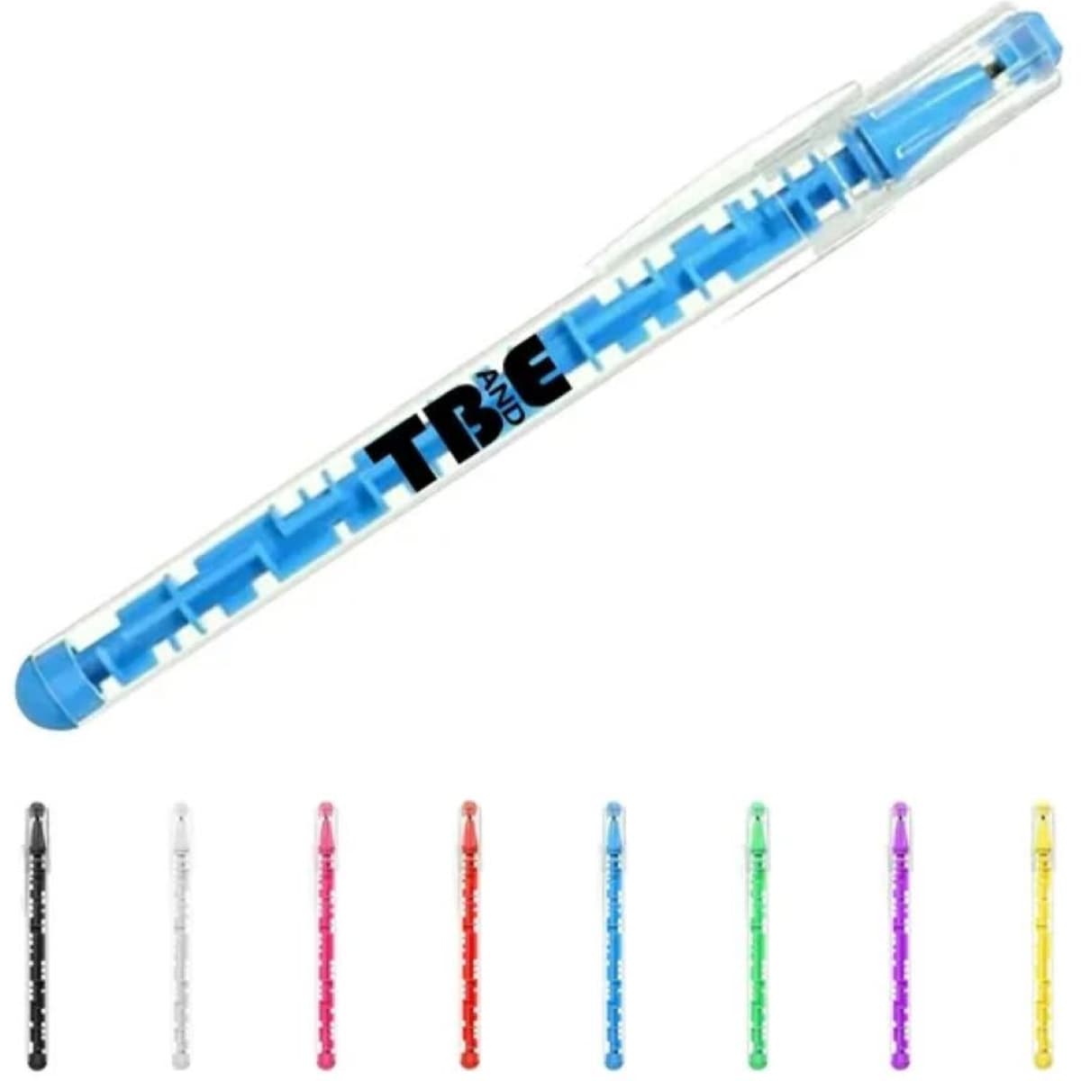 A blue ballpoint pen with a transparent body featuring a maze design, alongside pens in black, white, red, green, and yellow.