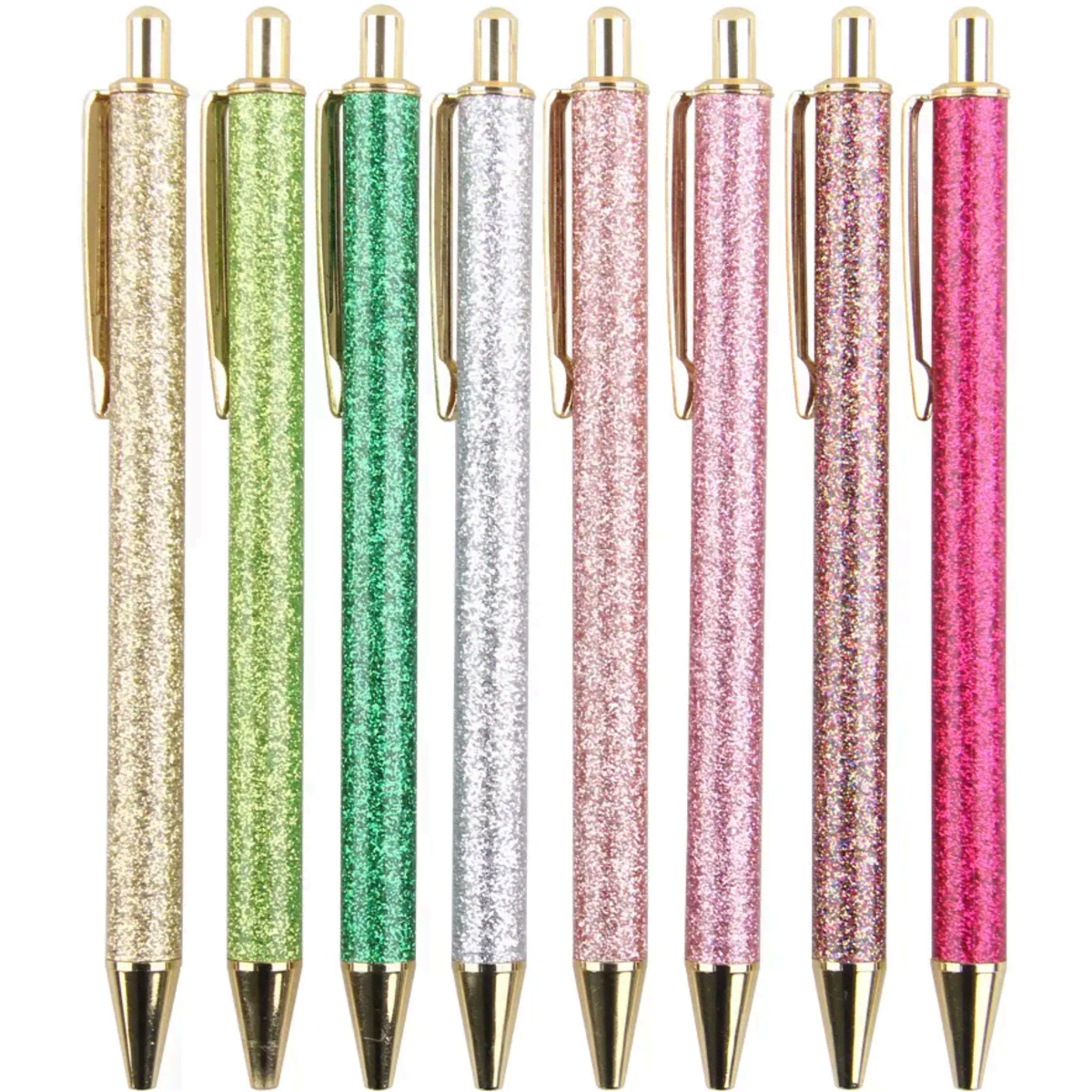 A set of eight ballpoint pens in glittery green, silver, pink, and gold, with gold hardware detailing.