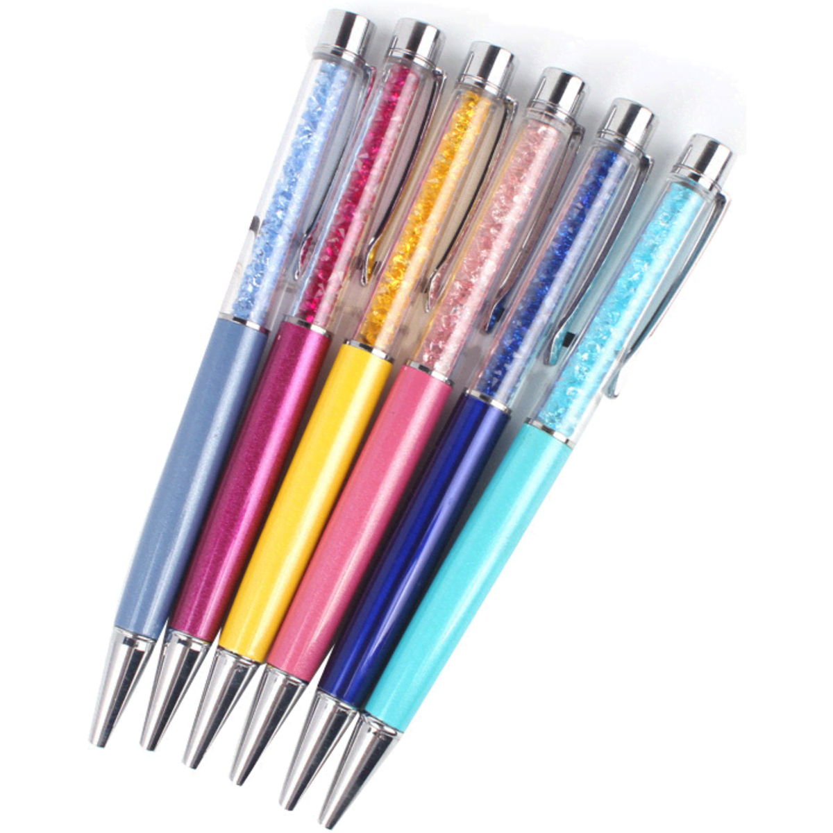 A collection of metal ballpoint pens in blue, yellow, pink, and turquoise with decorative crystals in the barrel.