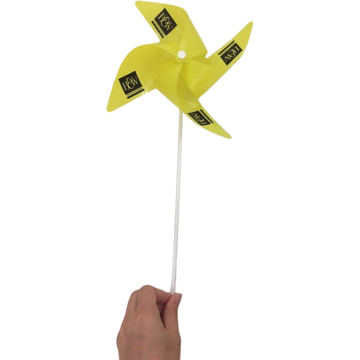 A yellow windmill toy with four blades, attached to a white handle, featuring a logo on each blade.