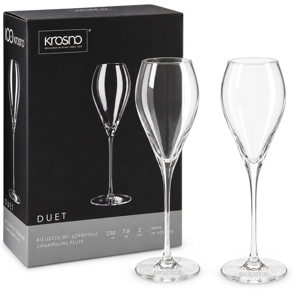 A set of two clear glass champagne flutes with elegant stems, packaged in a branded box.