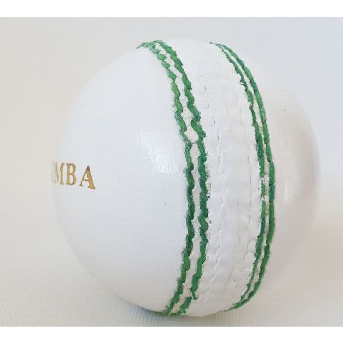 A white leather cricket ball with green stitching and a logo.