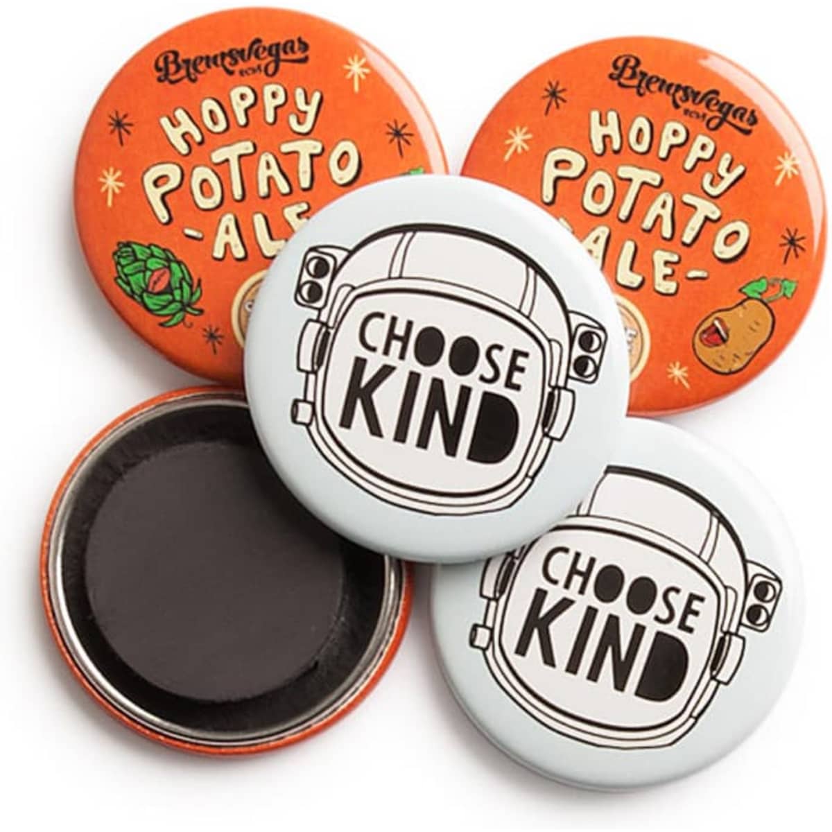 Four round magnets in orange and white, featuring various designs and shapes, with one displaying a logo.