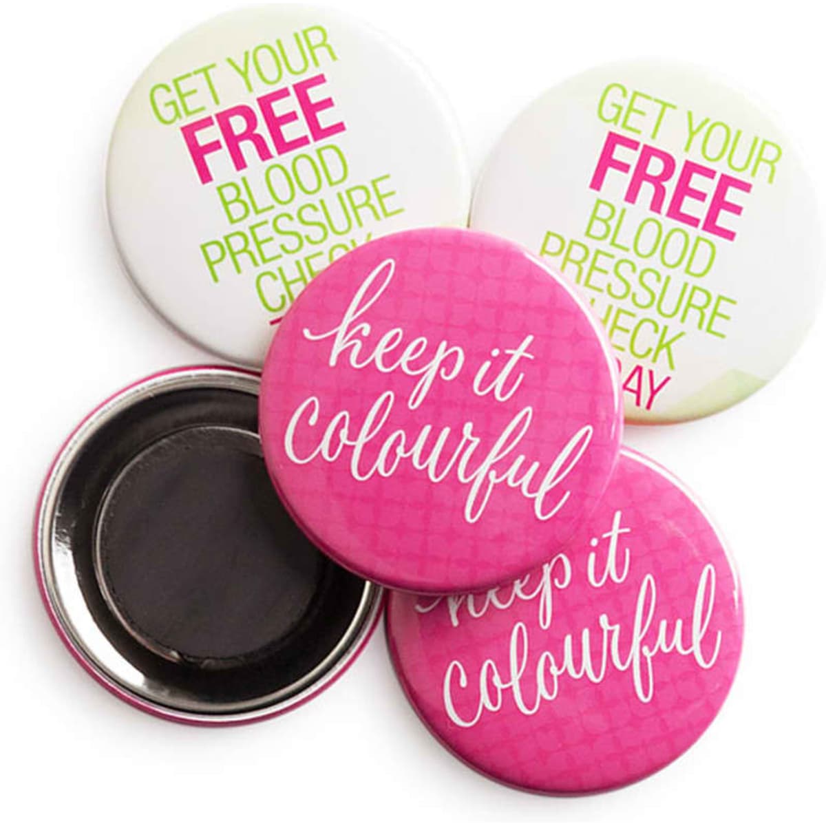 A set of round magnets in pink and white, featuring various text designs and a metallic backing.
