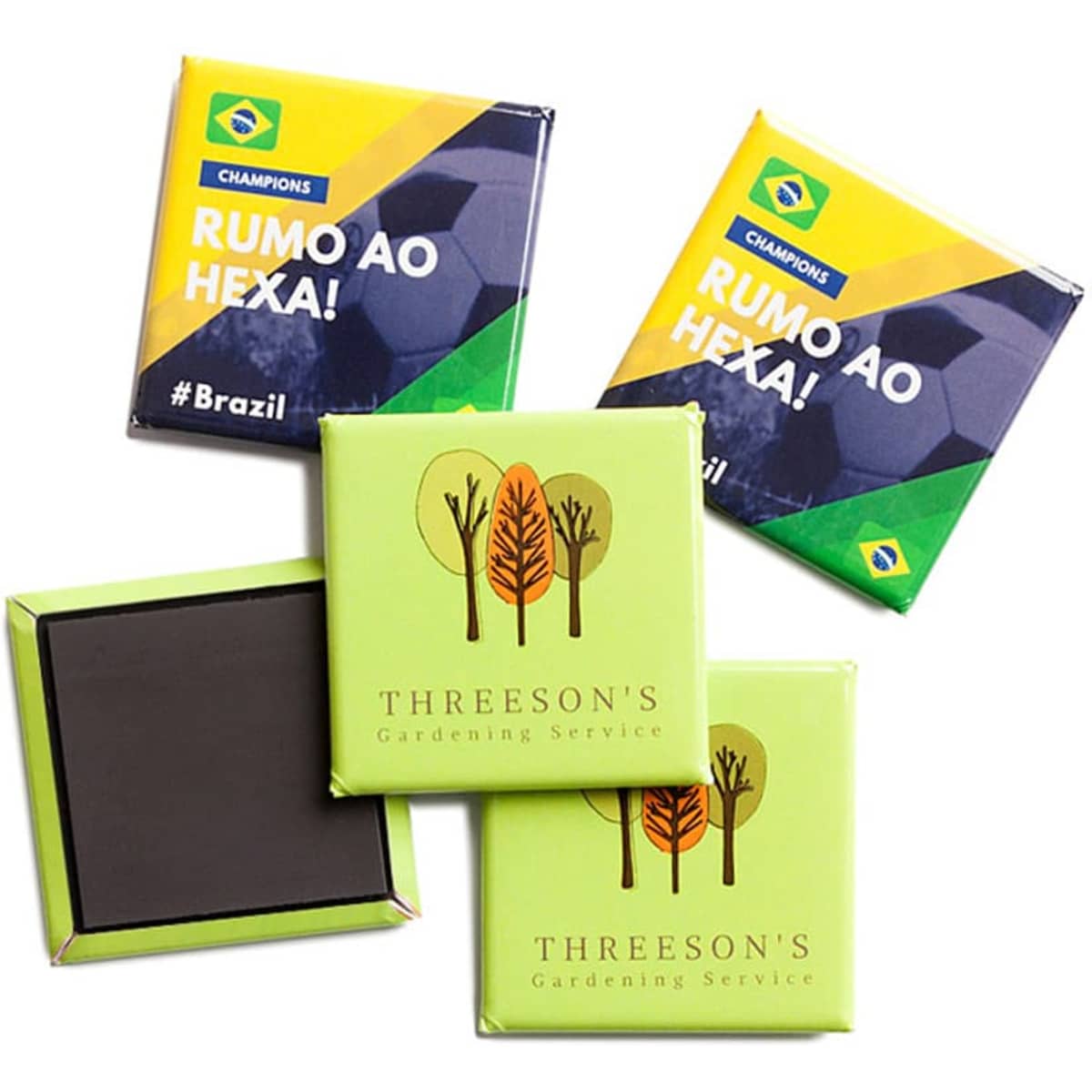 Custom printed square magnets in vibrant green and yellow, featuring logos and designs on a glossy surface.