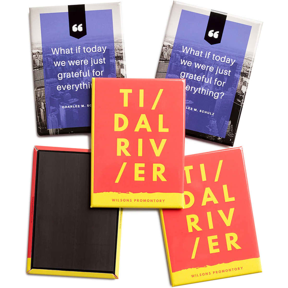 A set of vibrant printed magnets featuring a red design with yellow text, along with a background of blue and black magnets.