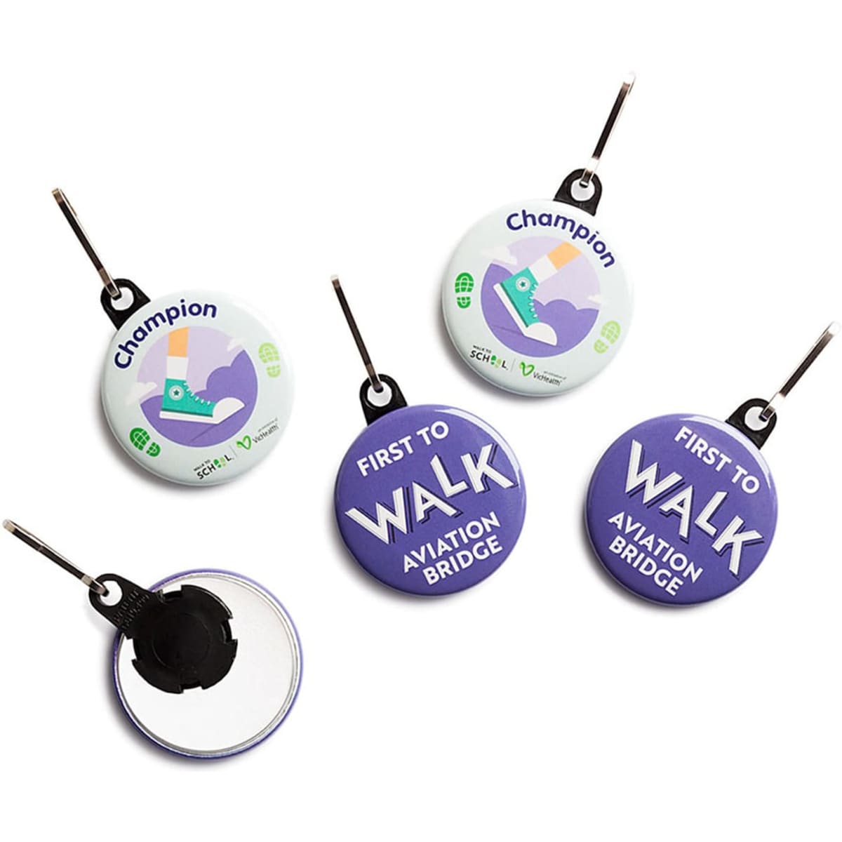 A collection of custom printed 38mm round zipper pulls in various colours with different designs and a logo.