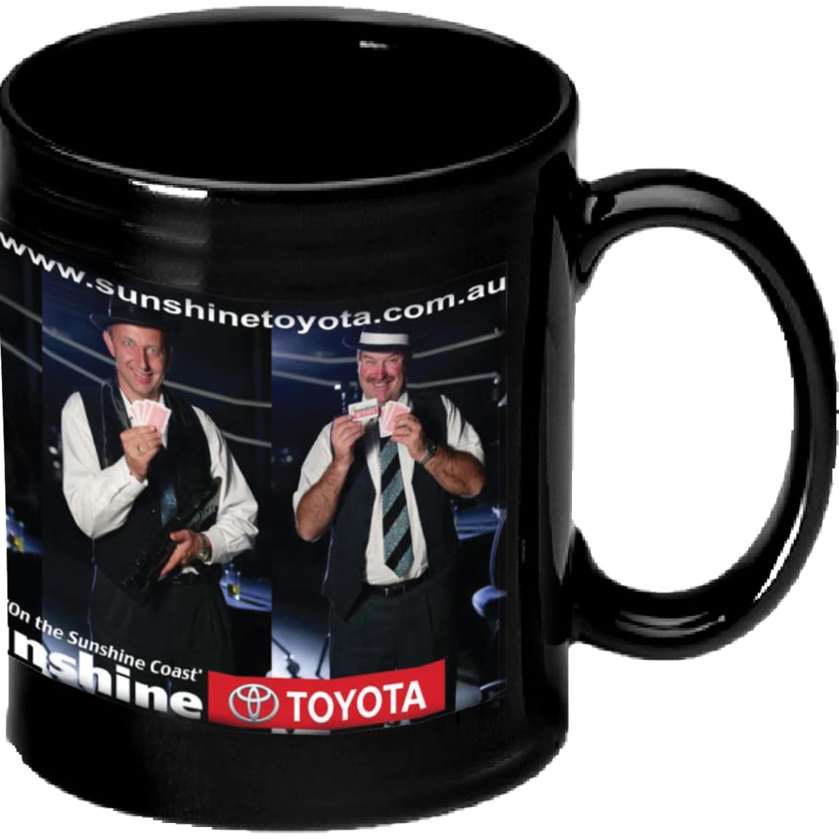 A black coffee mug featuring a promotional design with two men holding cards and a logo.