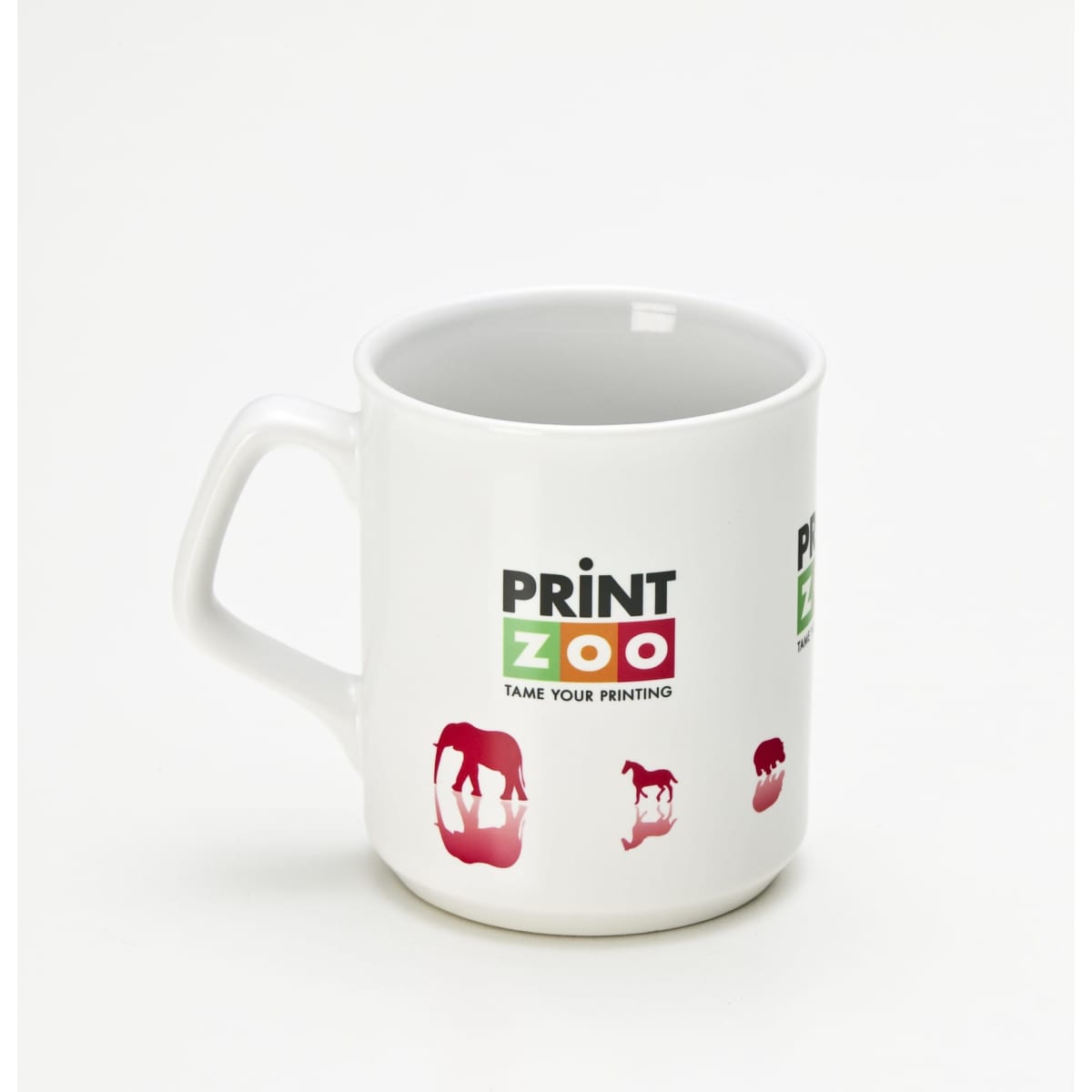 A white coffee mug featuring a handle and various animal silhouettes with a logo.