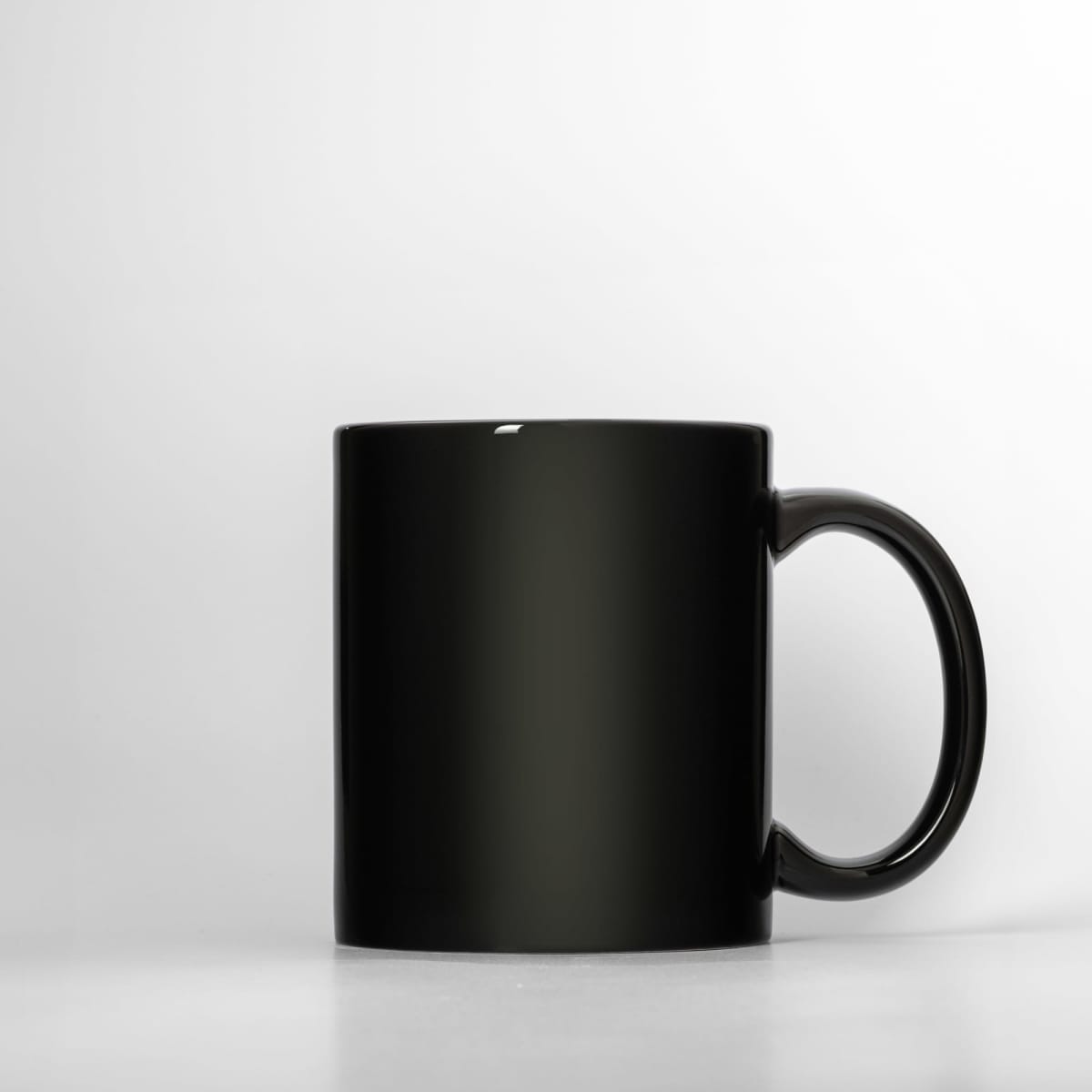 A drink bottle in sleek black, featuring a smooth finish and a sturdy handle. It includes a logo.