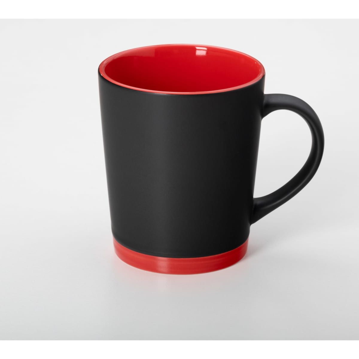A coffee mug featuring a black exterior and a red interior, with a contrasting red base and a handle.