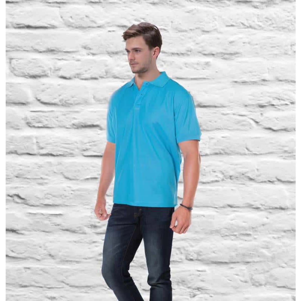 Aero Polo in bright blue, featuring a classic design and a logo, displayed against a brick wall background.