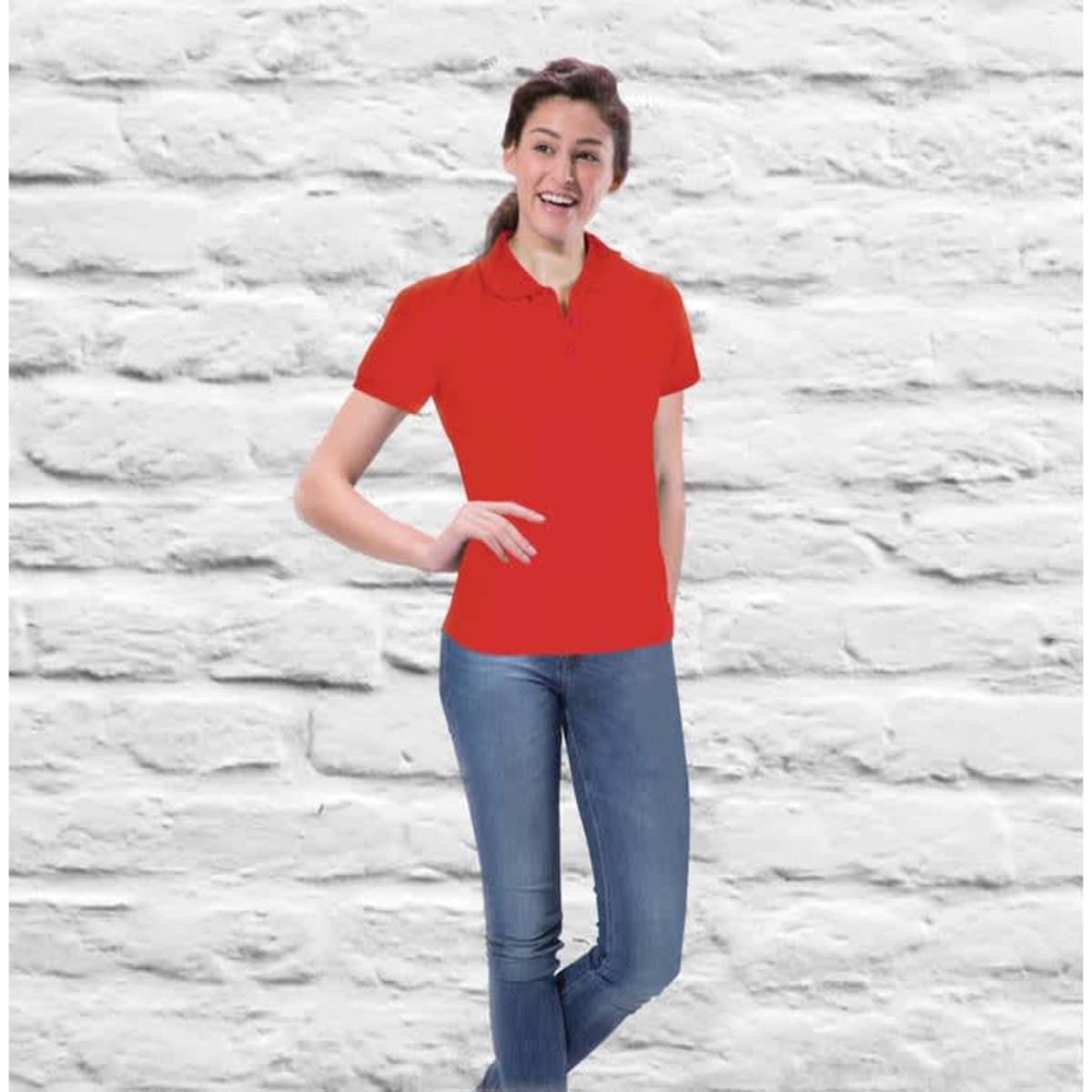 Aero Ladies Polo in red, featuring a classic collar and short sleeves, displayed on a model against a textured background.