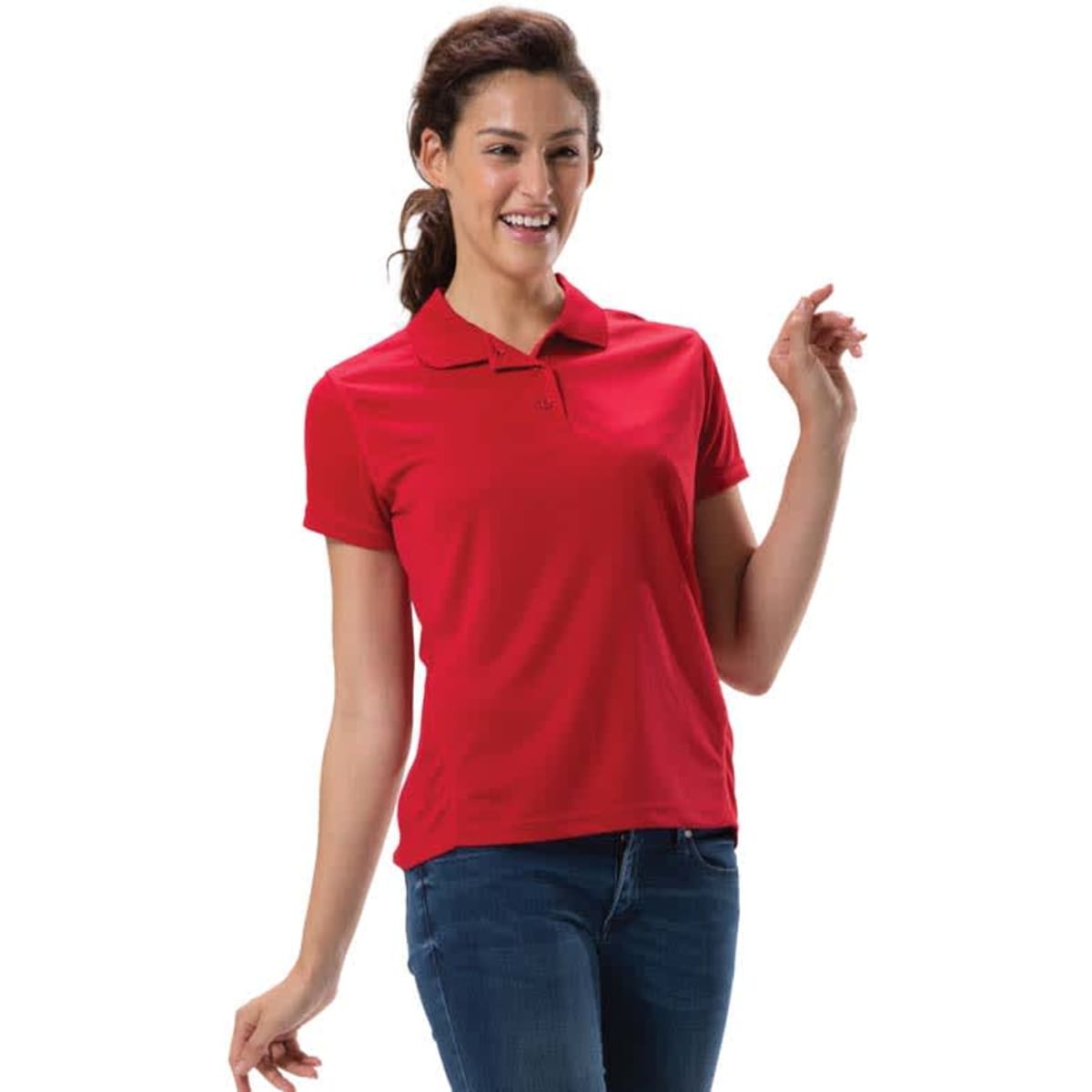 A woman wearing a red polo shirt, smiling and posed with one hand raised, showcasing a casual look.