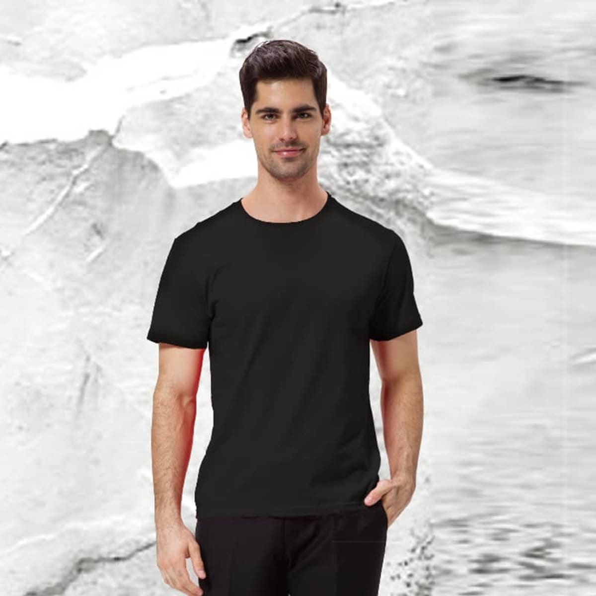 A black BASE TEE displayed on a model against a textured background. The product features a branding logo.
