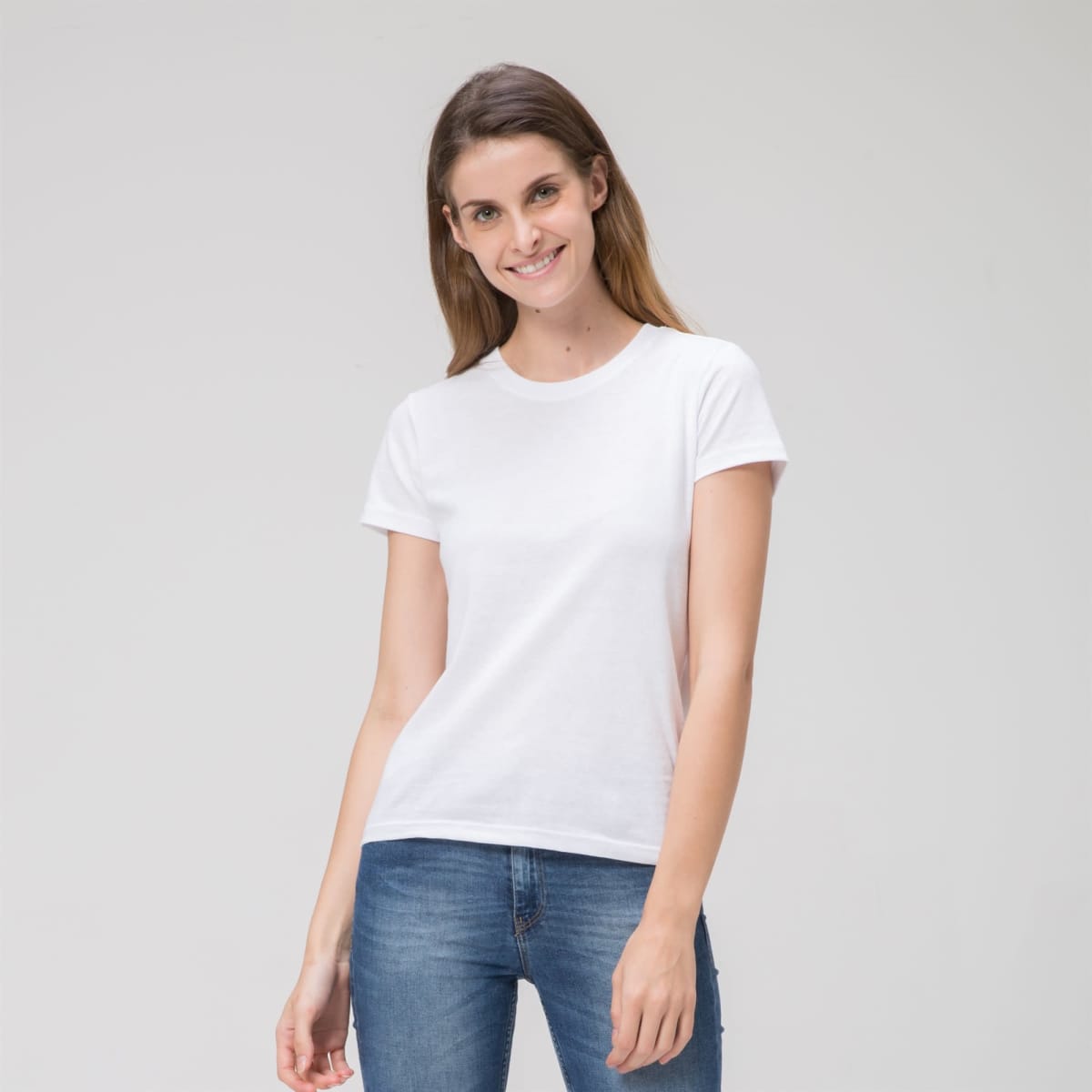 A white ladies' tee with short sleeves, featuring a fitted design and casual style. The model is smiling and wearing jeans.