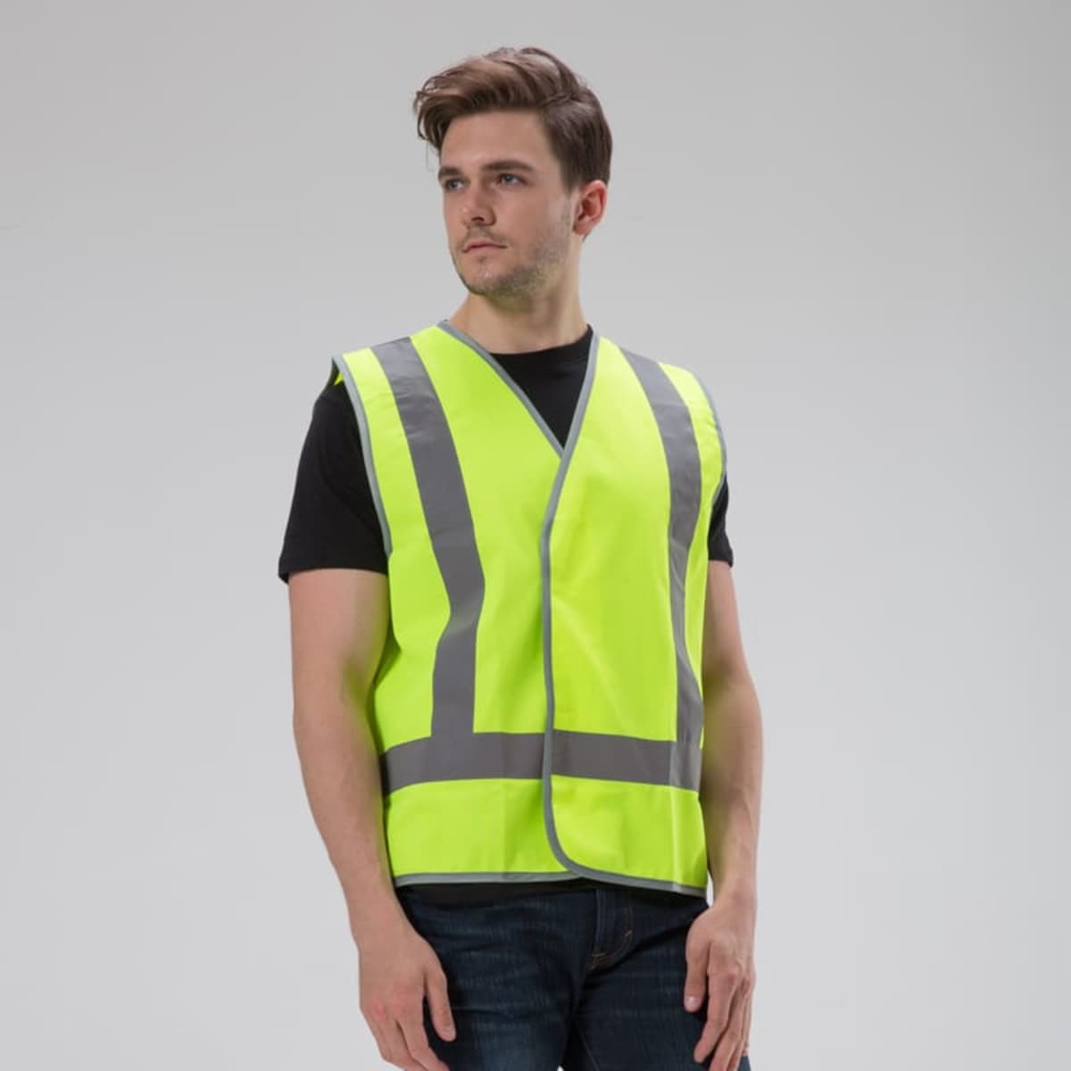 A fluorescent yellow safety vest with reflective tape, designed for visibility. Features a simple design and no logos visible.