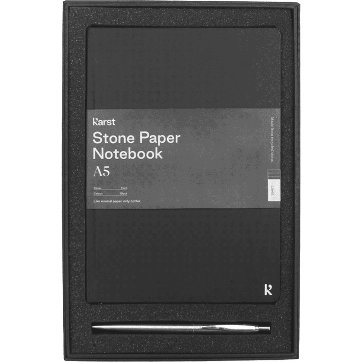 A black A5 stone paper hardcover notebook and a silver recycled stainless steel pen in a gift box.