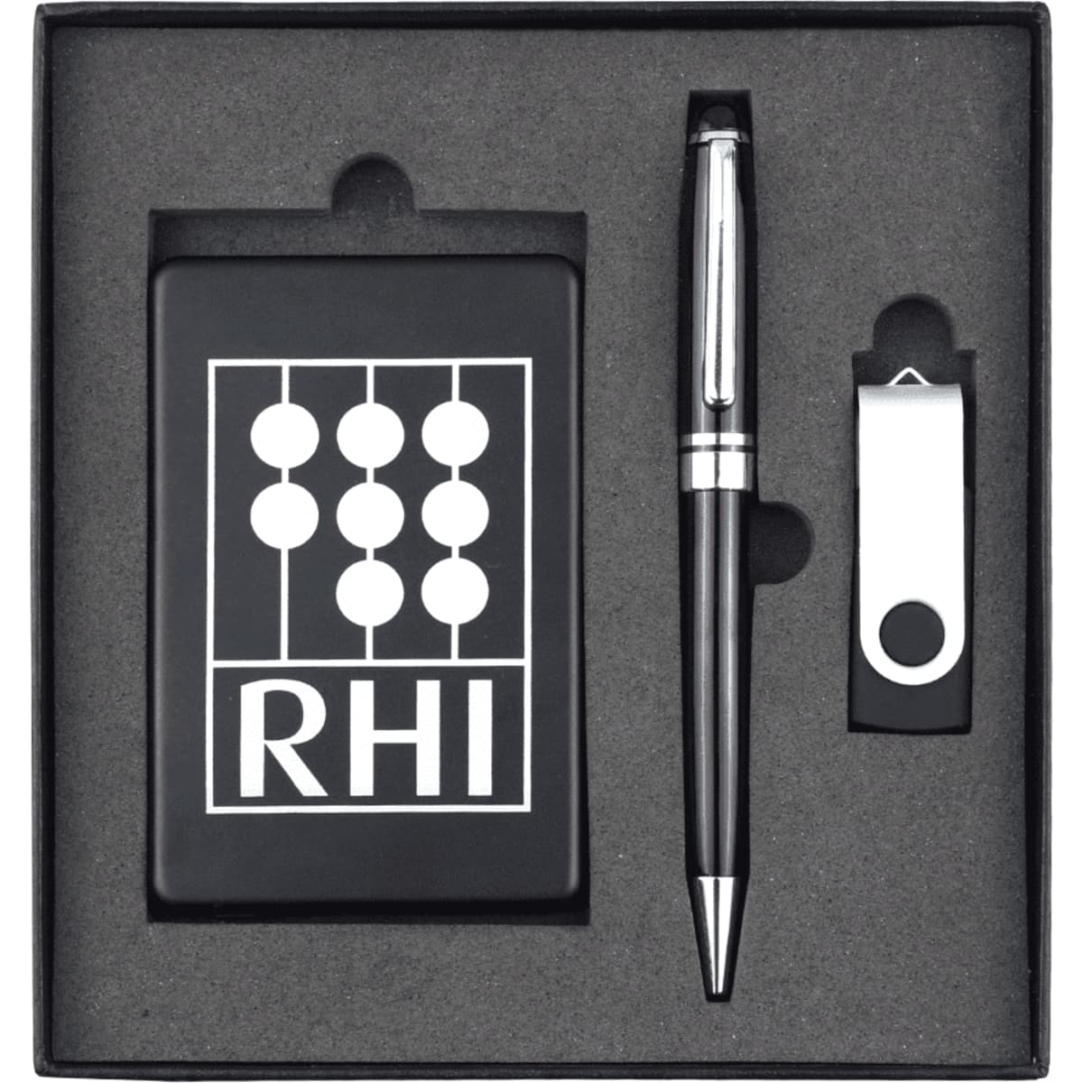 A black gift set containing a pen, a USB drive, and a card holder, all neatly arranged in a black box with a logo.