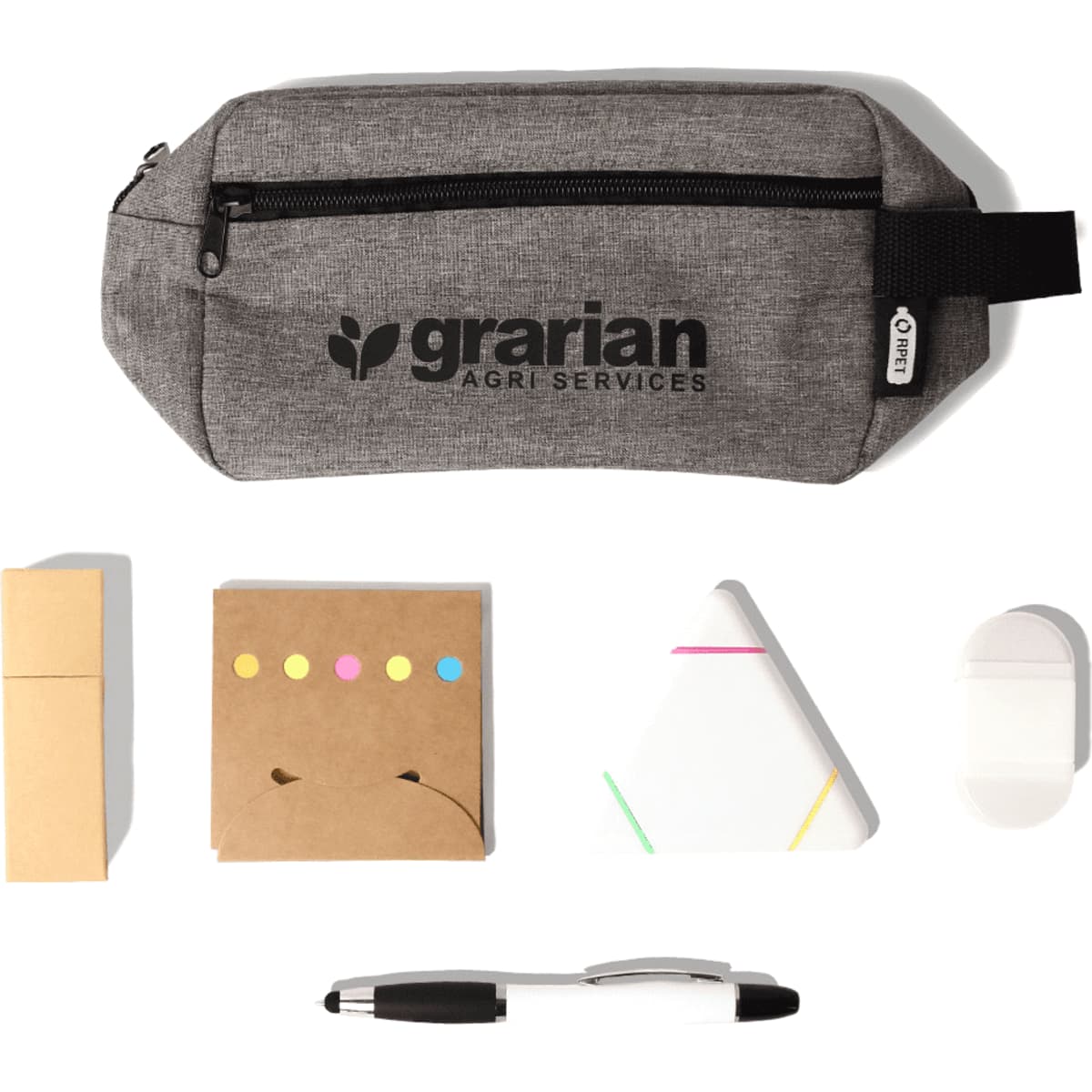 A grey pencil case with a logo contains sticky notes, a triangular notepad, a white eraser, and a black pen.
