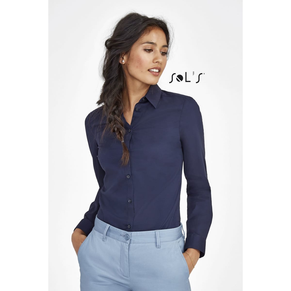 A long sleeve women's stretch shirt in navy blue with a button-up front and a subtle logo.