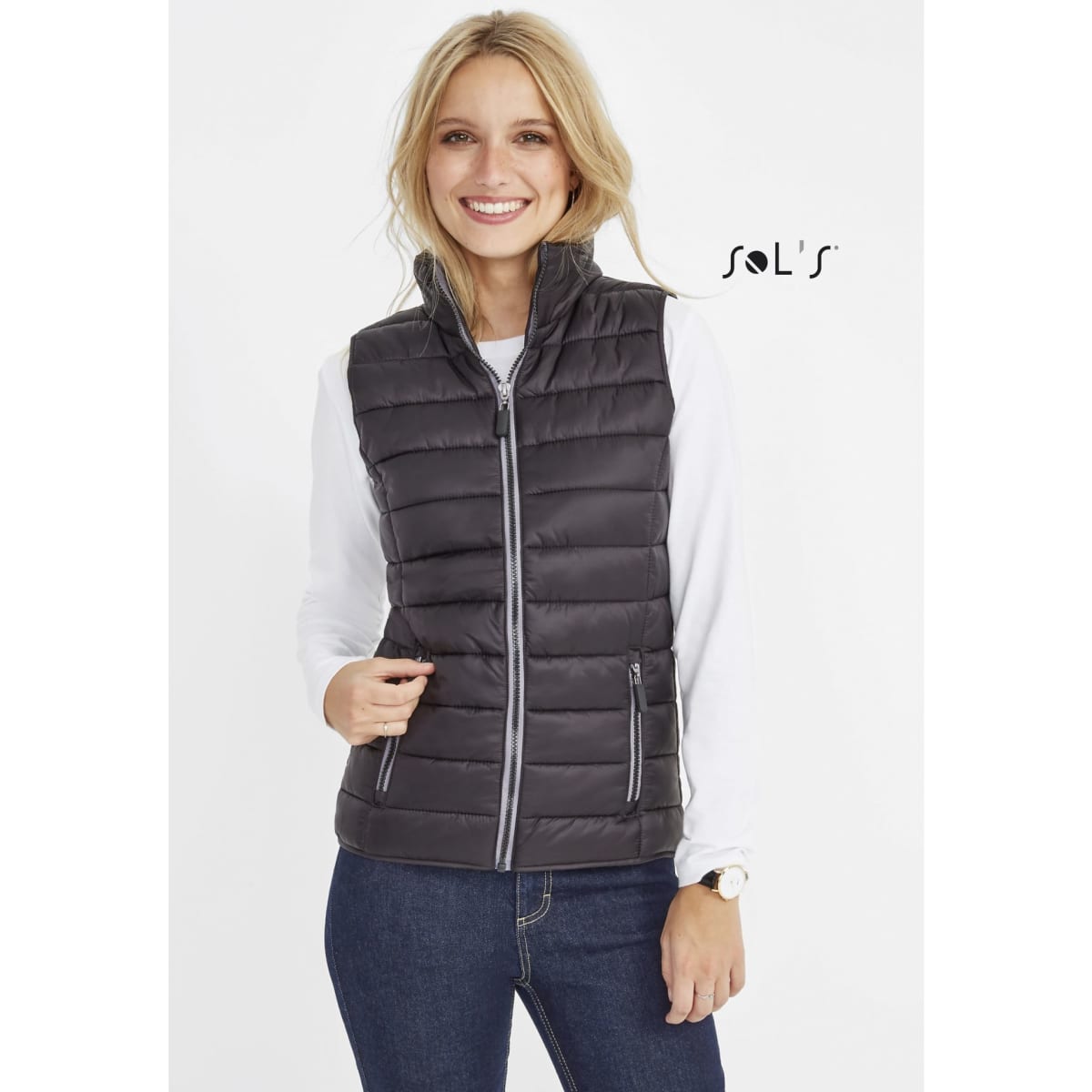 A women's puffer vest in black with a contrast neck section, featuring a zip front and pockets. It has a logo.
