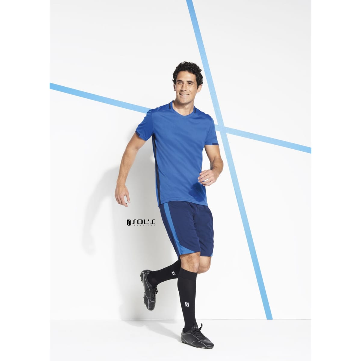 Men's sports outfit featuring a blue top, navy shorts, and black knee-high socks, with a branding logo visible.