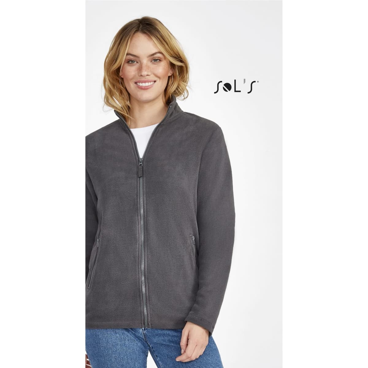 A women's plain fleece jacket in grey, featuring a zip front and a collar. It includes a branding logo.