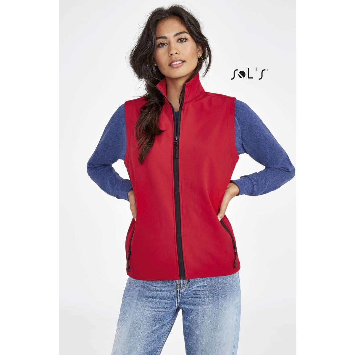 A red softshell vest with a zip and navy blue sleeves, featuring a logo on the upper left.