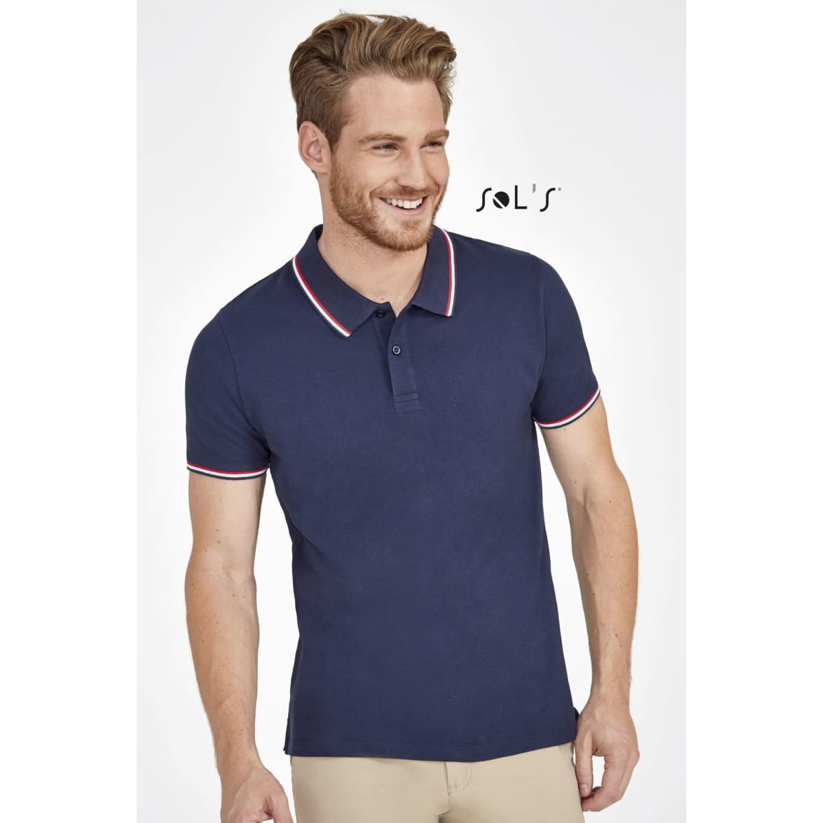 A navy blue men's polo shirt made of 100% cotton, featuring a contrasting collar and sleeves. It has a logo.