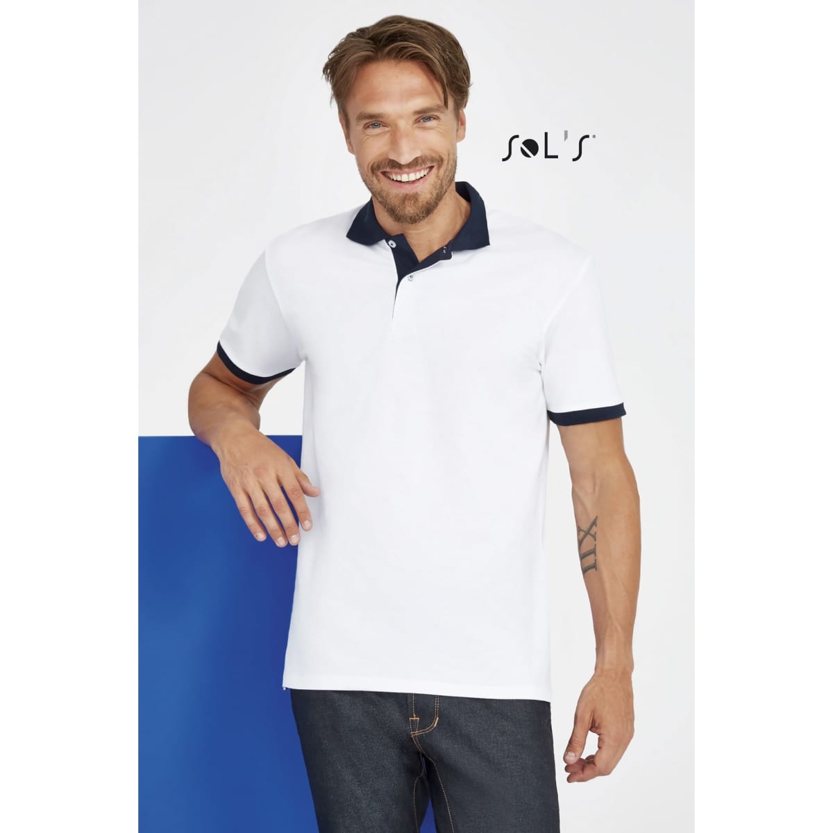A unisex polo shirt in white with a navy blue collar, made from 100% ring spun cotton, featuring a logo.