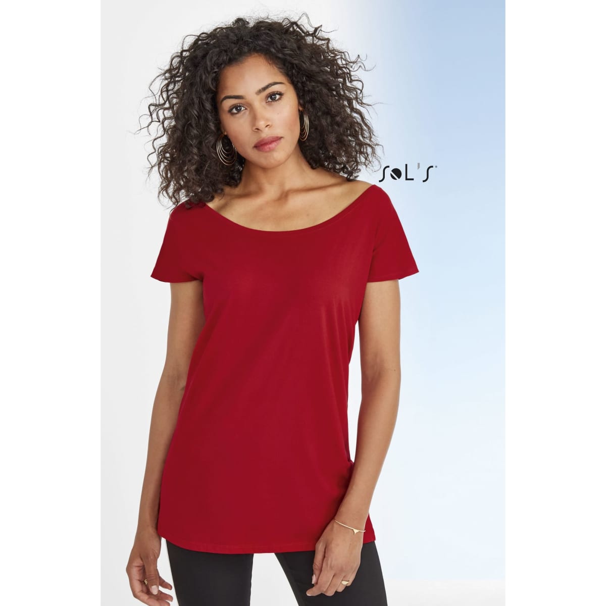 A red women's T-shirt with a low neckline and kimono sleeves features a silky finish. It has a logo.