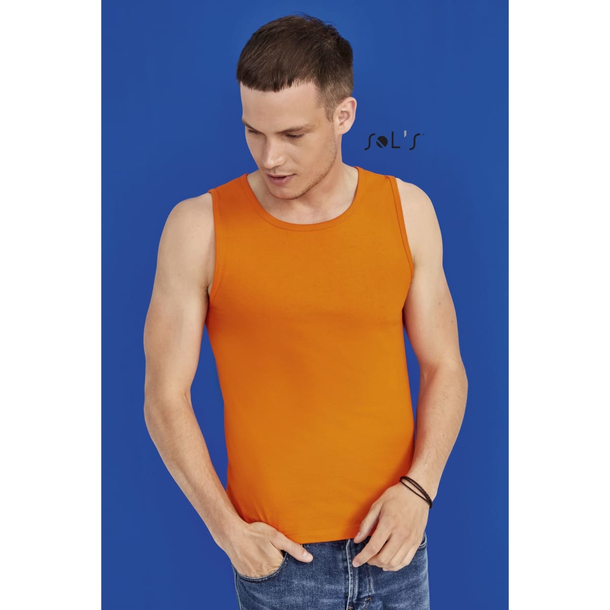 An orange men's tank top is displayed on a model against a blue background. The top has a logo.