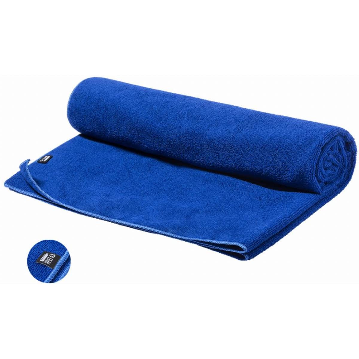 A rolled blue towel featuring a tag, showcasing a soft and fluffy texture.