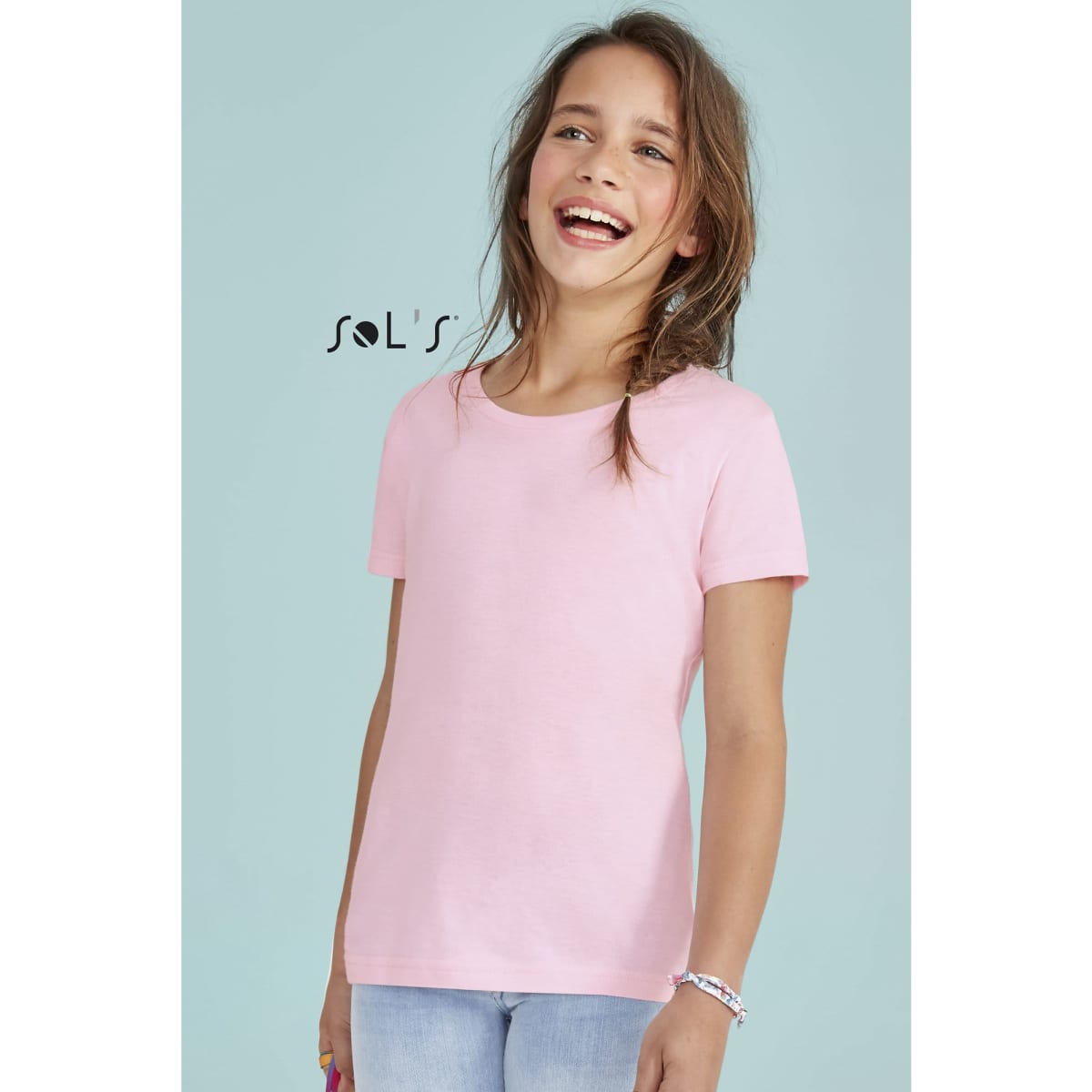 A pink children's T-shirt for girls, sizes 2 to 12, featuring a simple design and a logo.