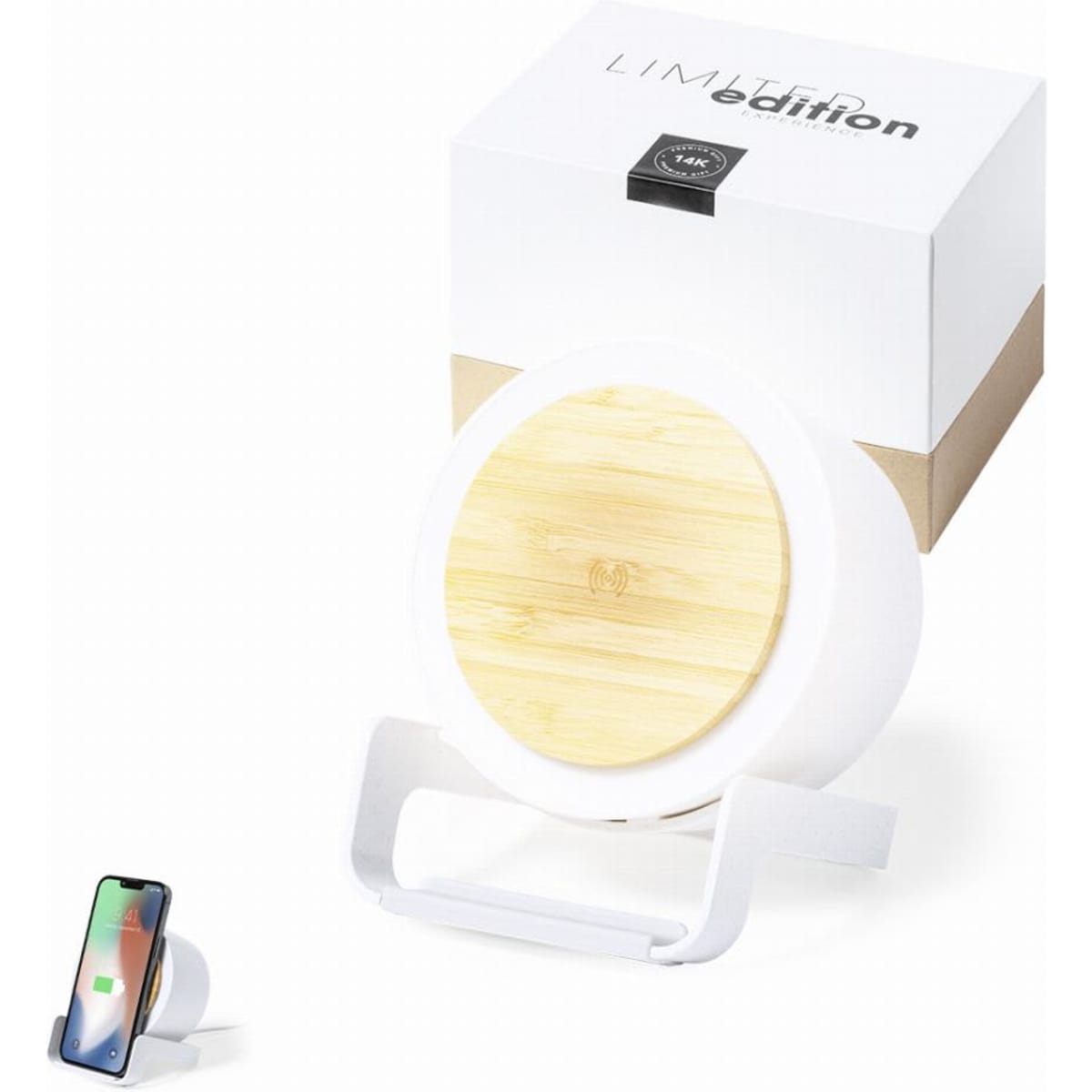 A wireless charger with a bamboo top and white base, accompanied by its packaging and a smartphone.