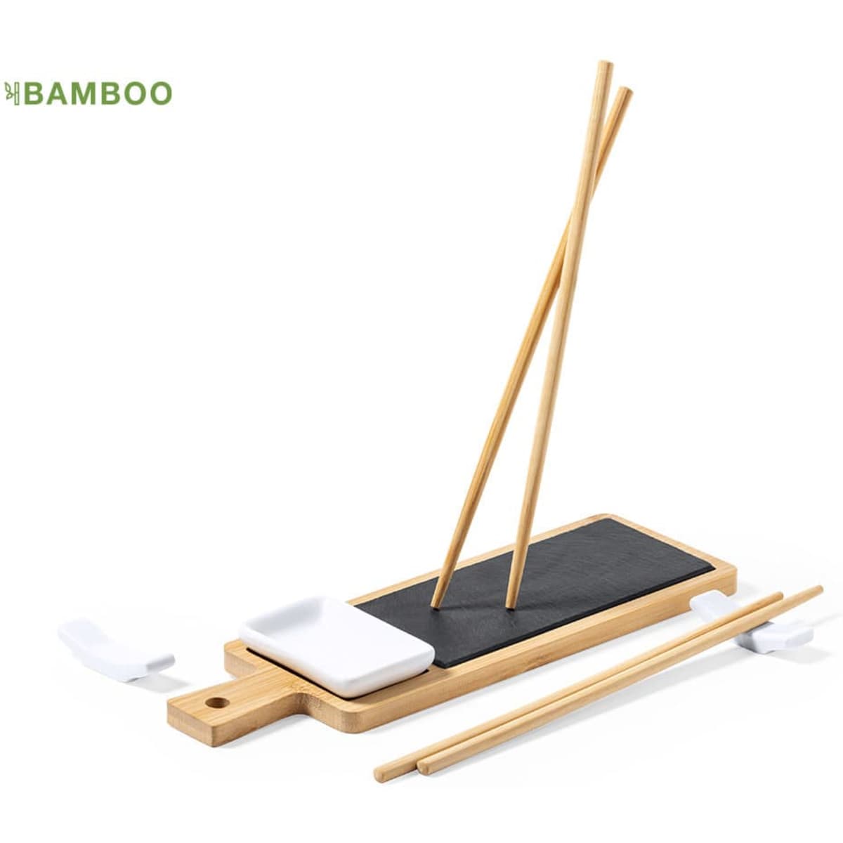 A bamboo sushi serving set featuring a black slate plate, bamboo chopsticks, and white sauce dish.